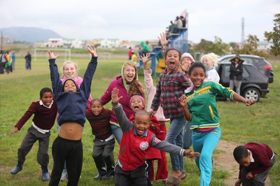 Harborside Senior Emily Swanson playing with children in South Africa during her senior project